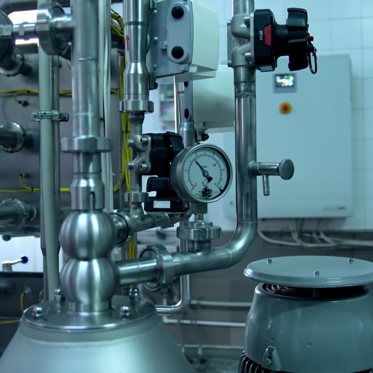 Interior of dairy factory with fermentation tank. Technology equipment at dairy farm. Sterile production