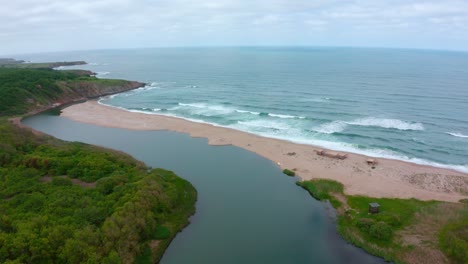 aerial view of the veleka beach with some big waves n sinemorets, bulgaria during a cloudy weather
