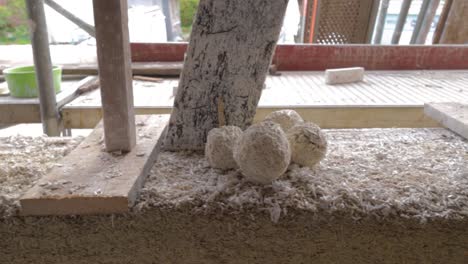 detail view of test sample balls of hempcrete in a construction site