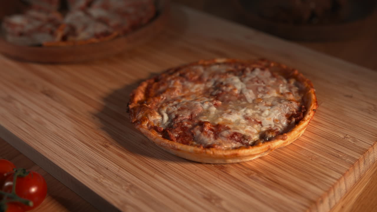 Cutting a Mini Pizza on a Wooden Board