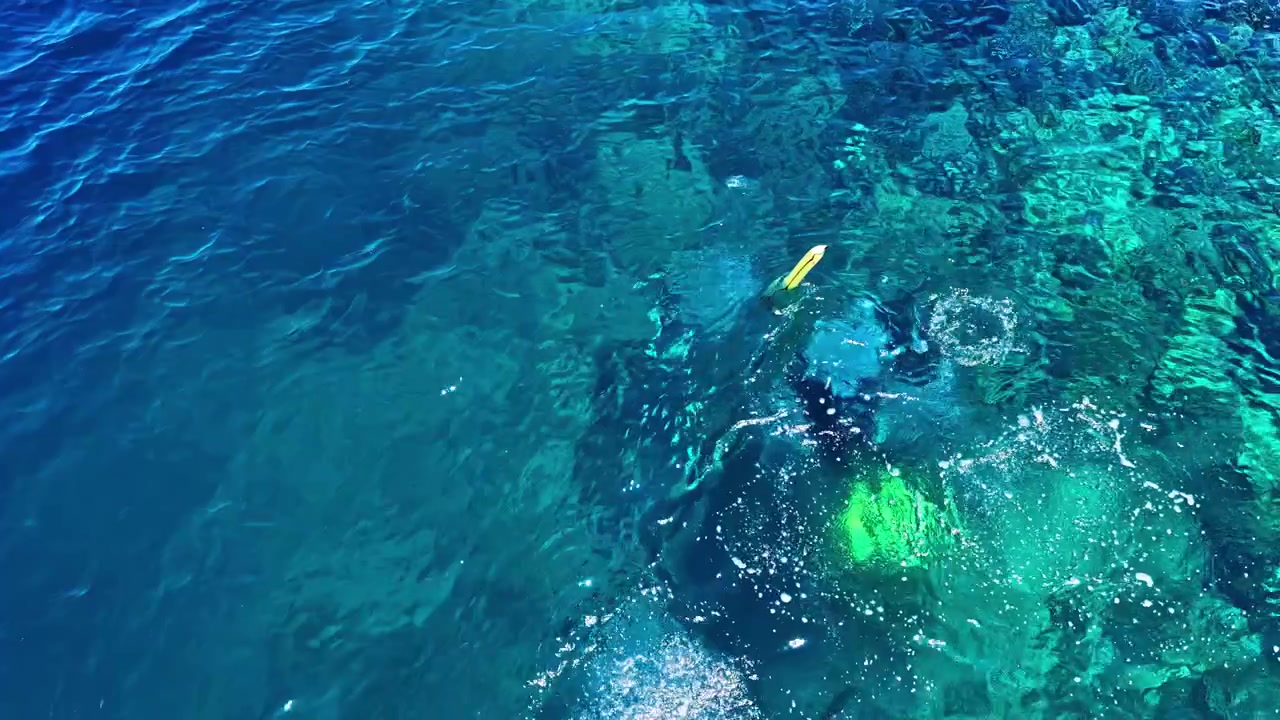 Snorkeling adventure captured from above in Port Barton Beach