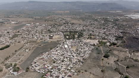 drone shot of amatitan surrounded by blue agave agricultural lands, jalisco