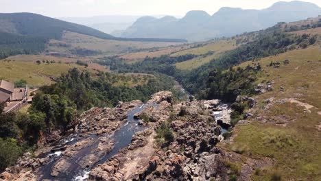 aerial view of drakensberg mountain range viewpoint and waterfall, south africa