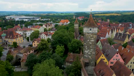 4k aerial drone video of the röderturm tower on the walled city of rothenburg ob der tauber, germany