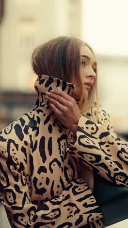 stylish woman in leopard print coat