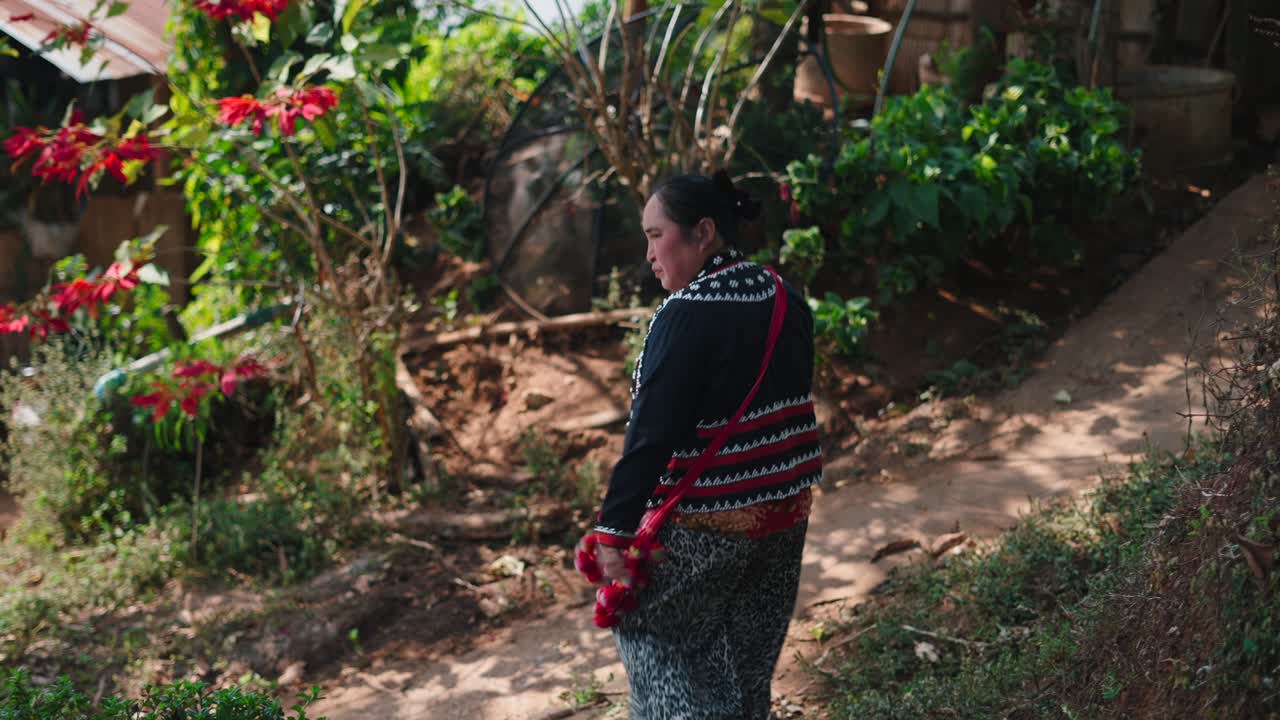 Woman in Traditional Clothing in Rural Asia