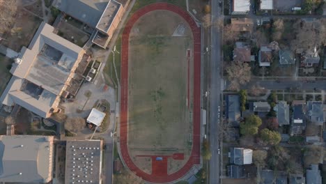 aerial top down view over durham football field and track in noth carolina, usa