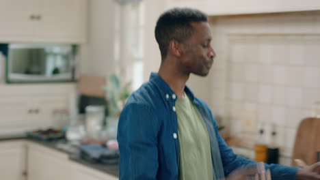 happy-african-american-man-dancing-in-kitchen-having-fun-dance-celebration-enjoying-weekend-at-home