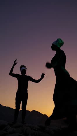 dynamic silhouettes dancing at sunset