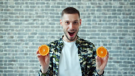 man holding orange slices