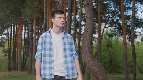 young man in a forest