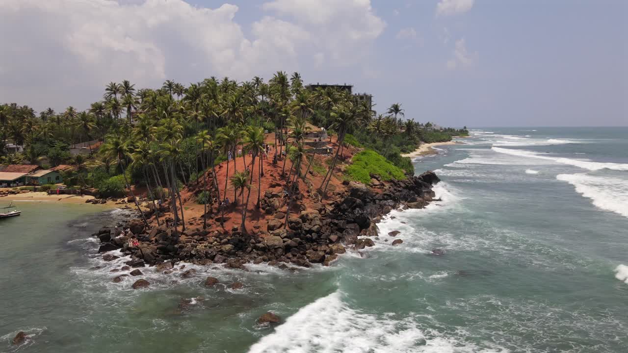 Aerial orbit around famous coconut tree hill in Sri Lanka in holiday resort