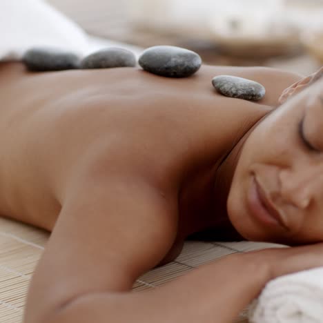 Woman-Getting-Hot-Stones-Massage-At-Spa