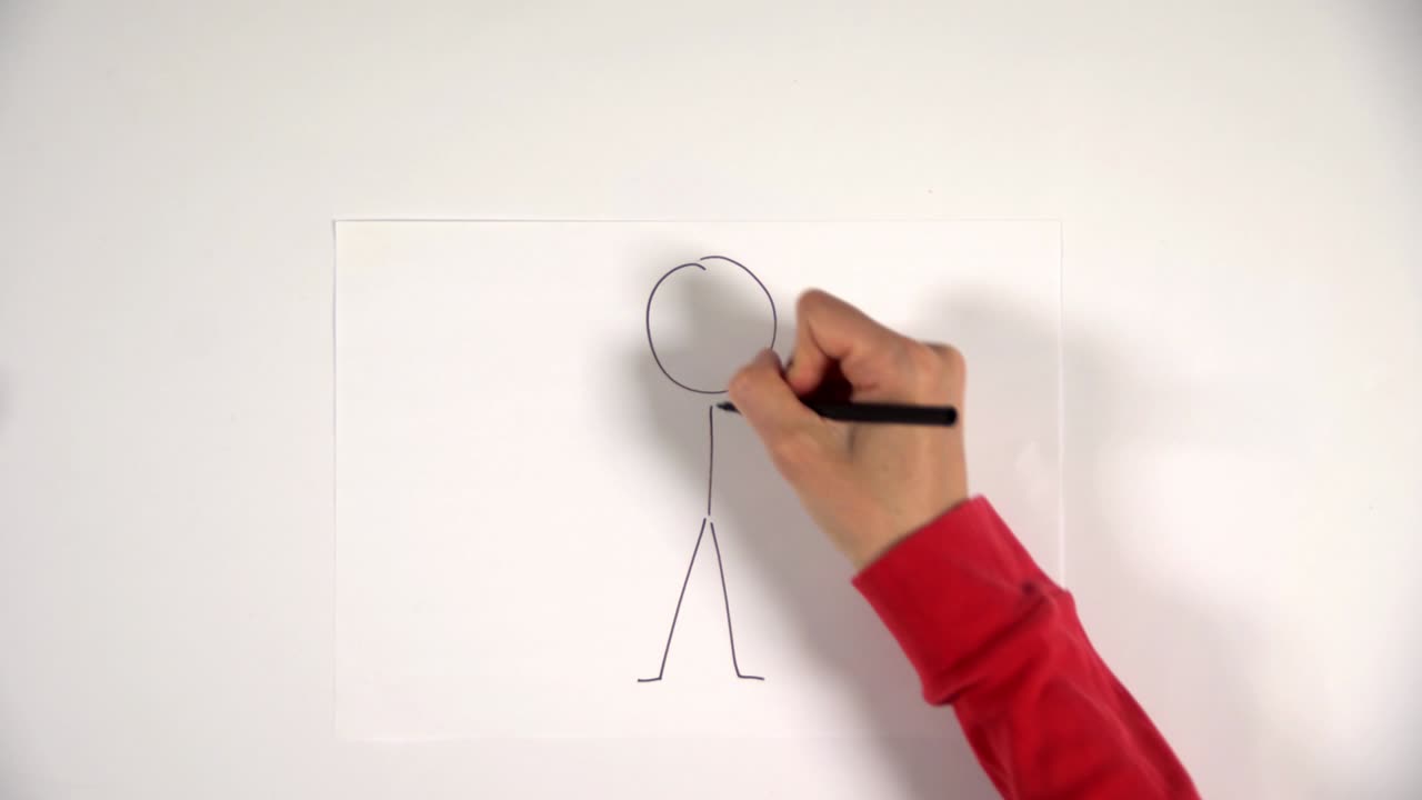 la mano dibuja un boceto de hombre de palo en una hoja blanca, cobra vida. se mueve a la izquierda para la presentación.