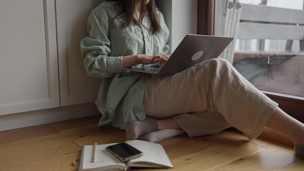 Woman Working from Home on Laptop