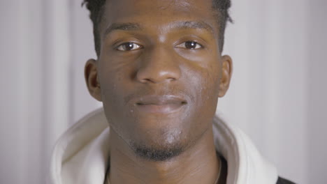 close-up of smiling young african american guy