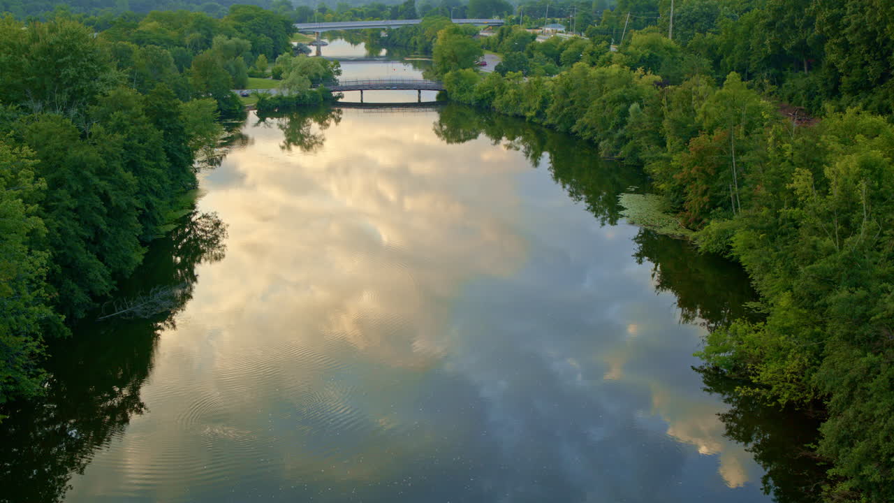 Drone flying at a slow pace above Ann Arbor's Huron River during summer.