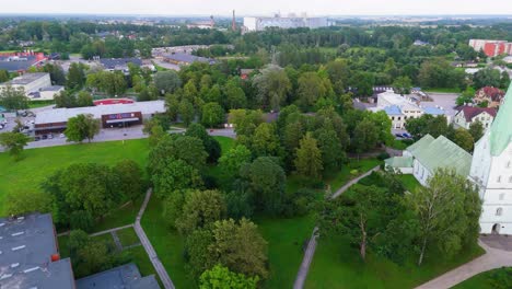 aerial panorama of dobele town center and evangelical lutheran church at summer scenic drone view in golden hour light over dobeles historic center on a warm summer evening peaceful latvian town
