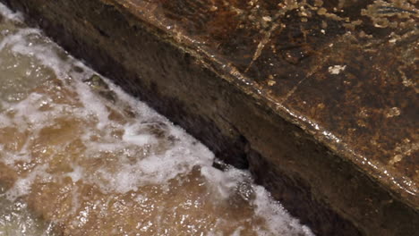 waves crash against steps in cartagena colombia