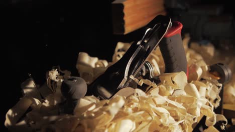 placing hand plane down on shavings dramatic wind impact slow motion