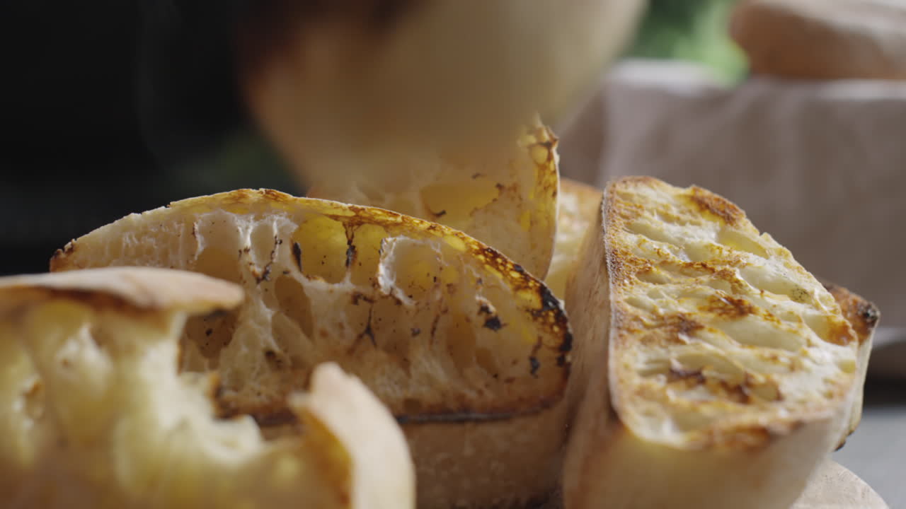 Putting Roasted Bread from BBQ on Table