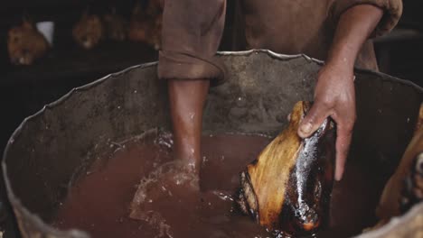 african man washing the meat