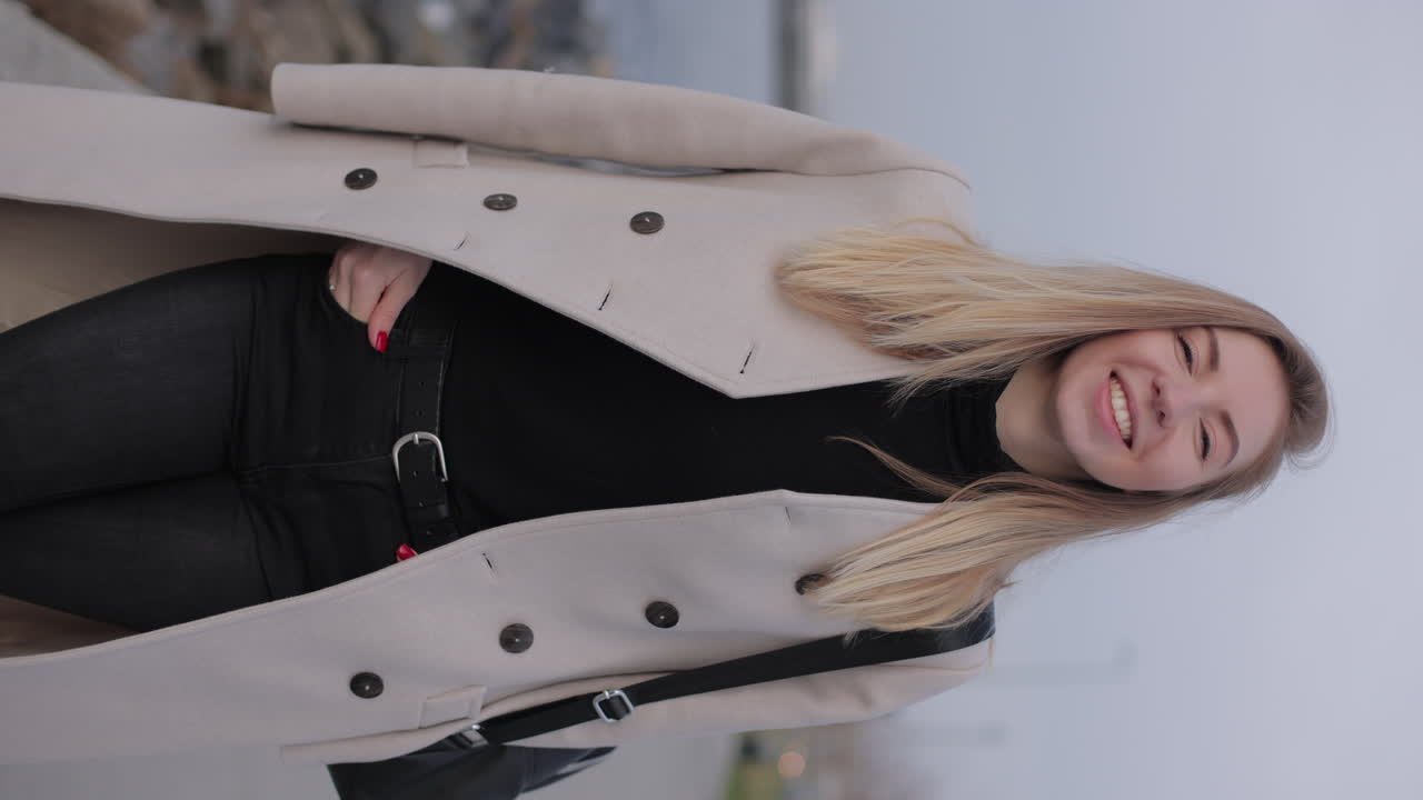 Woman Wearing a Beige Coat and Black Pants