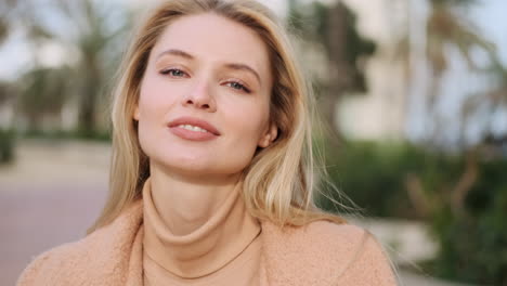 Young-woman-smiling-at-the-camera.