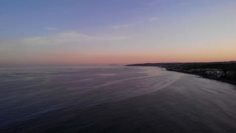 Mediterranean-Sea-Sunset-At-Costa-del-Sol-Beach,-Estepona,-Spain---aerial-drone-shot