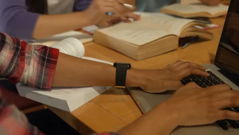 classmates studying in library