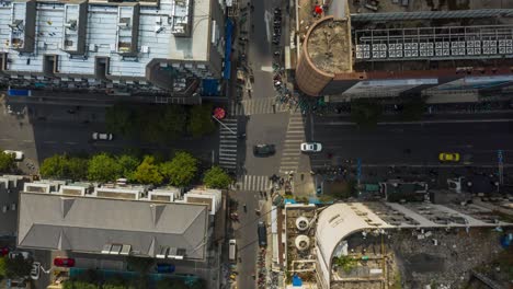 nanjing city center sunny day time traffic street crossroad aerial topdown timelapse panorama 4k china