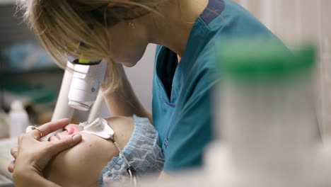 beautician doing laser skin treatment