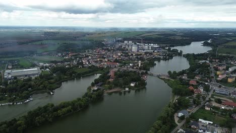 town-by-lake-industry-water-bridge-aerial-very-long-shot