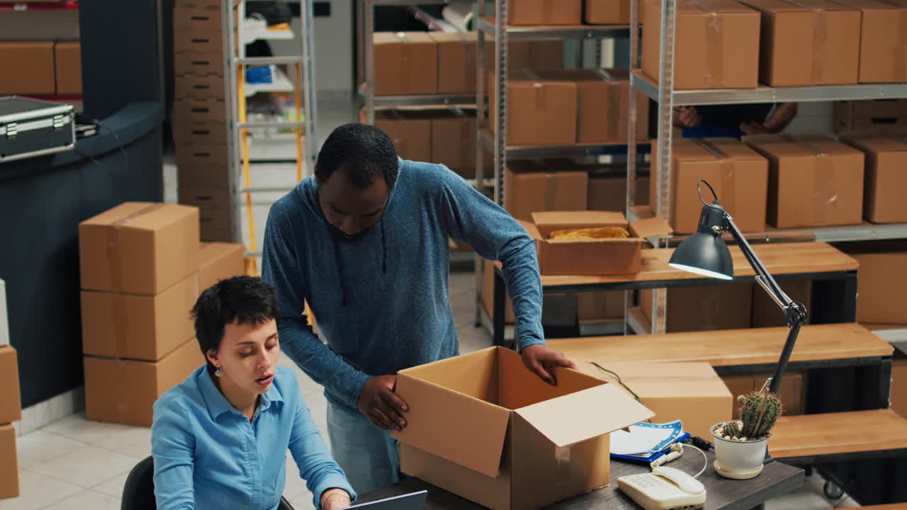 Warehouse workers preparing orders for shipment