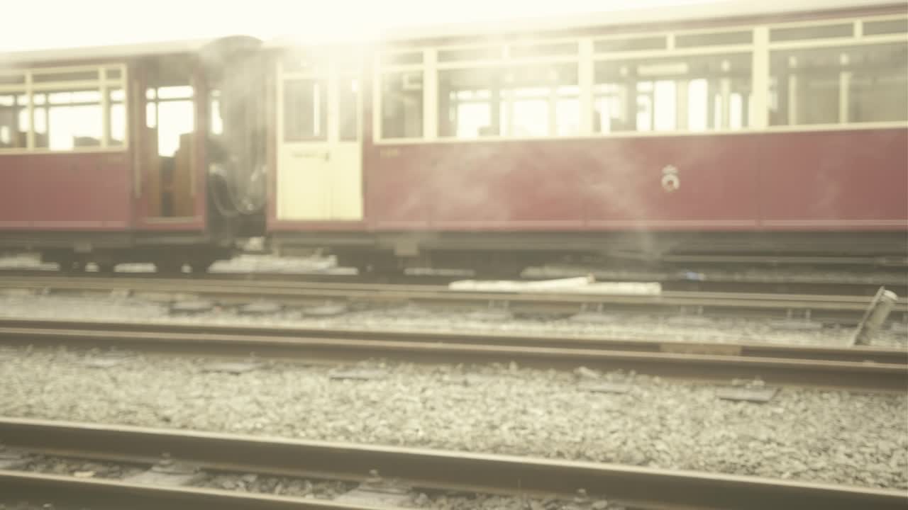 Vintage Steam Train on Railway Tracks