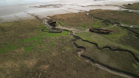 rusted shipwreck orbit on salt marsh at fleetwood marshes nature reserve