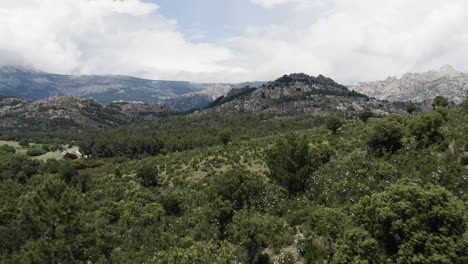 low level drone aerial over the epic and cinematic mountain ranges of sierra de guadarrama in the parque nacional del la pedriza spain