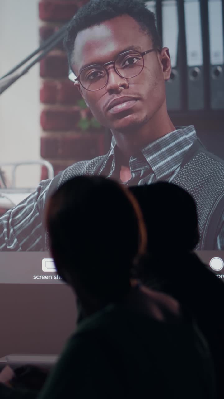 Vertical Video Work team gathers in the office at night for a web conference with the CEO