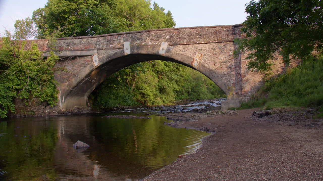 Wide shot of the Bridge Of Craigisla with the river Isla. On the B954