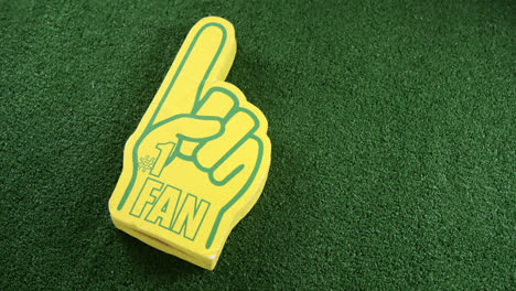 foam hand on artificial grass 4k