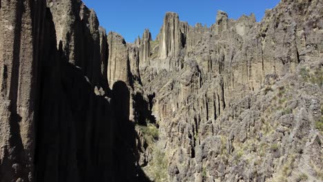 Aerial:-Sharp-eroded-rock-spire-canyon-in-Valle-de-las-Animas,-Bolivia