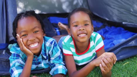 portrait of children lying and smiling