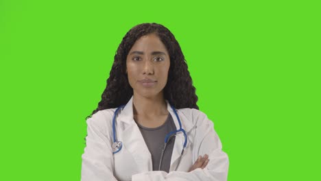 portrait of female doctor in white lab coat with stethoscope against green screen 4