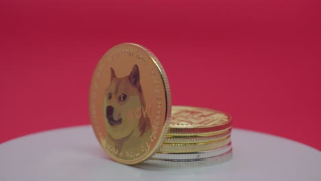 dogecoin (doge) cryptocurrency price goes down - metal doge coin is spinning in front of the red background.