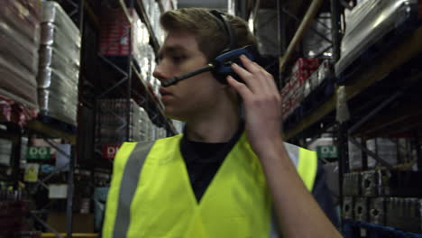 man locating stock in a storage warehouse, shot on r3d