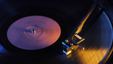 spinning retro vinyl phonograph record close up. 4k. time lapse. beautiful colorful movie. neon led light