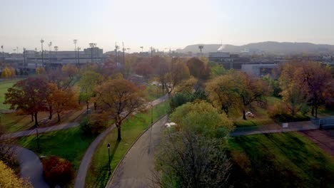 aerial shot over a public parc in montreal on a colourful autumn morning