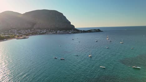serene coastal view with boats in calm blue sea under clear sky