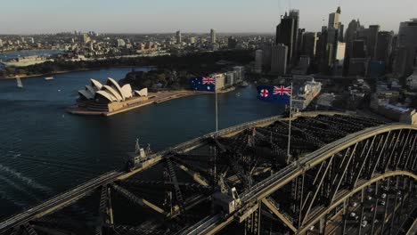 top down view of harbor bridge, opera house and sydney cityscape