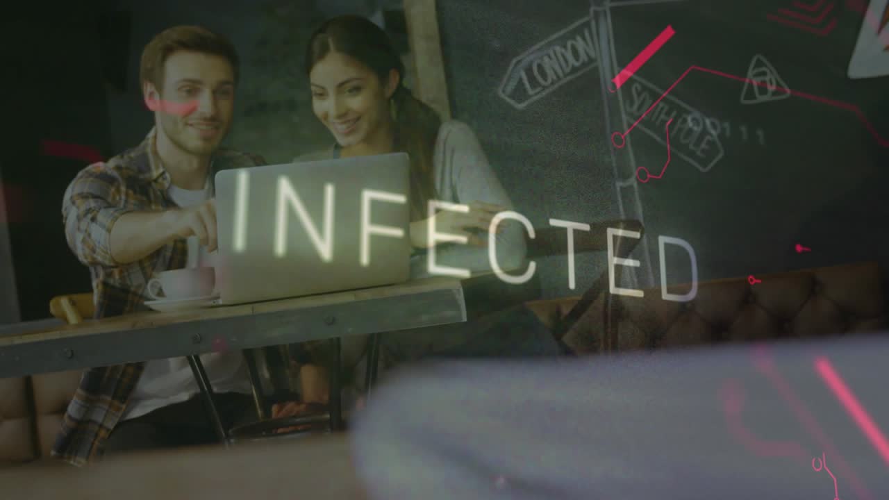 Tech collaborators reviewing documents via laptop after red graphics flashing neon INFECTED text